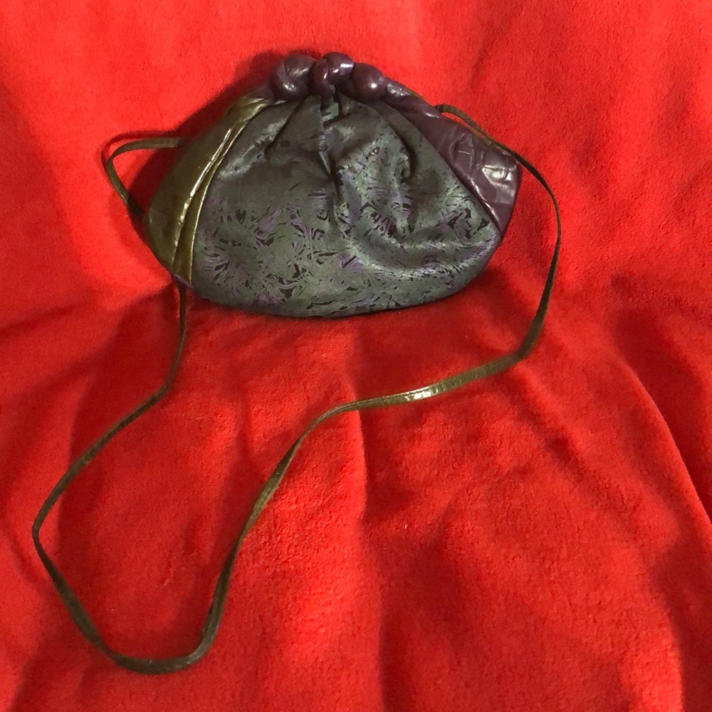 Purple and green clutch